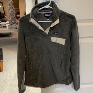 Patagonia pullover. Grey and cream with pockets on sides. Warn twice brand new.